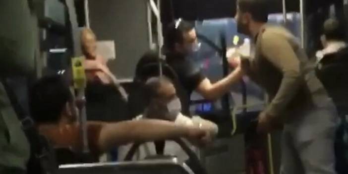 Metrobüste 'saygısızlık yapıyorsun' kavgası: Birbirine tükürdüler