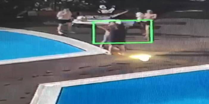 Köpeği tekmeleyen site yöneticisini havuza attı