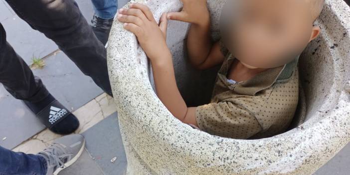Beton çöp kovasına sıkışan çocuğu itfaiye ekipleri kurtardı