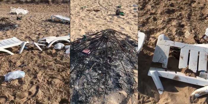 Bozcaada’da sahil partisinde şezlongları kırıp, şemsiye yaktılar!