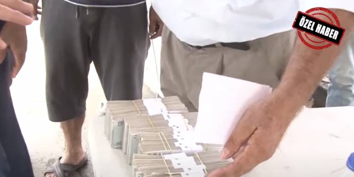 Yangın bölgesinde deste deste para dağıttı. Peki amaç ne?