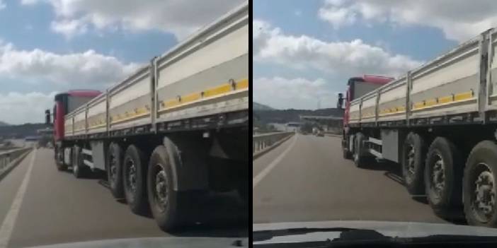 TIR şoförü aracından inip önüne geçtiği otomobili tekmeledi