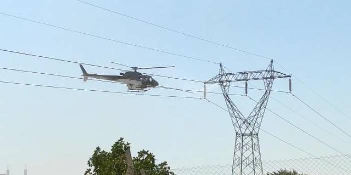 Yüksek gerilim hattı helikopterle temizlendi, vatandaşlar paniğe kapıldı