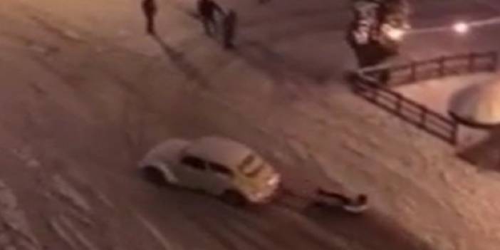 Otomobile ip bağlayıp kayak yaptı