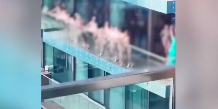 Gökdelende çıplak poz veren bir grup kadına gözaltı